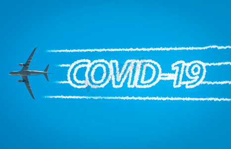 飞机离开喷气尾迹，里面写着“COVID-19”字样