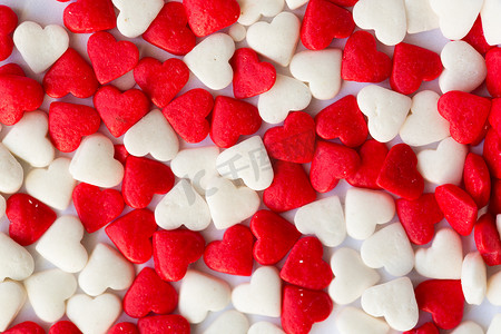 粉色小糖果摄影照片_用于装饰糖果的小爱心背景。