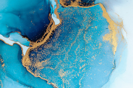 蓝色水墨摄影照片_大理石液体水墨艺术画在纸上的豪华蓝色抽象背景。