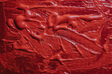 丙烯酸漆的彩色背景滴下饱和红色纹理、复制空间、横幅背景