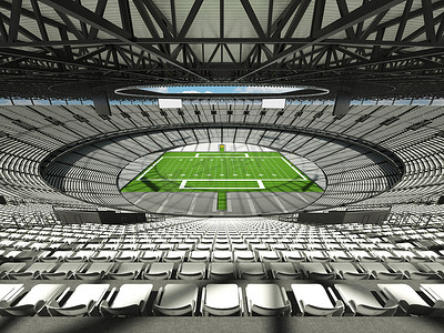橄榄球场摄影照片_有白色座位和贵宾包厢的大型美丽的现代美式橄榄球场