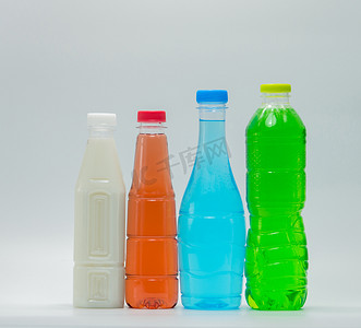 创意瓶中摄影照片_白色背景中的现代设计瓶软饮料和豆奶