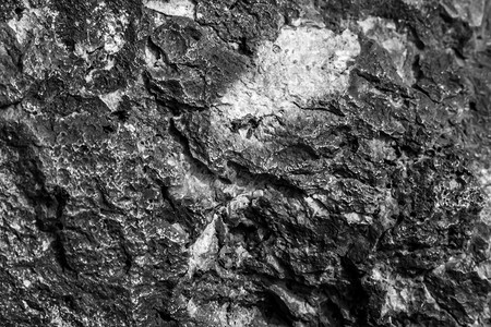 石英砂摄影照片_抽象自然美宏观特写背景悬崖开裂岩石戏剧性的石头苦恼的脸纹理强烈的锯齿状锋利的边缘山脉。