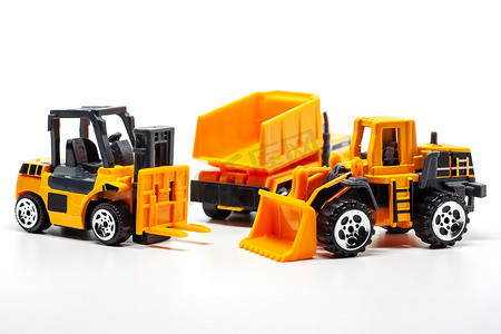 重型叉车摄影照片_黄色玩具重型机械包括自卸车、推土机和叉车
