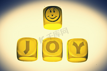 立方体上带有“JOY”一词的欢乐符号
