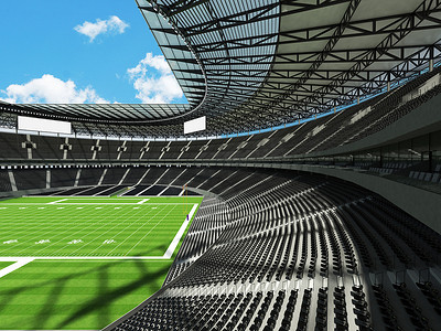 有黑色座位和贵宾包厢的大型美丽的现代美式橄榄球场