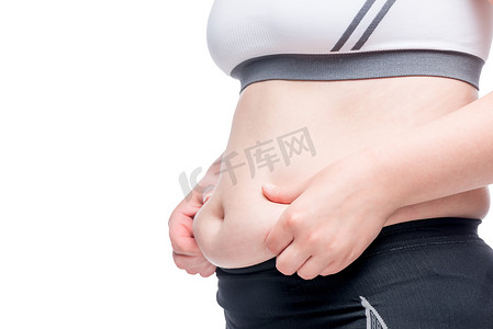 肥胖女性摄影照片_穿着运动服的孤立肥胖女性形象，腹部特写
