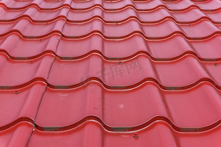 特写纹理背景中的红色光泽屋顶瓷砖