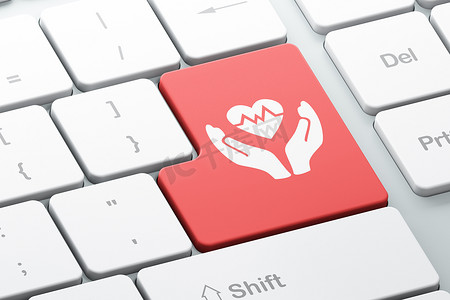保险概念：电脑键盘背景上的心脏和手掌