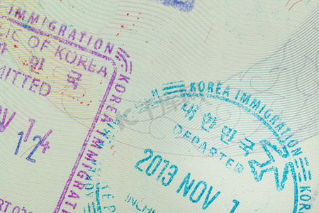 旅行印章摄影照片_移民旅行概念的韩国签证承认印章