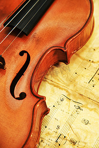 交响乐团摄影照片_在笔记背景的老小提琴