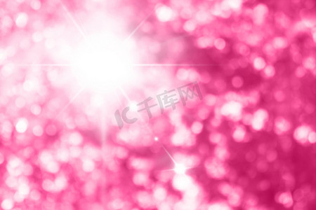 美丽闪闪发光的粉红色背景，图片上带有亮粉色散景效果，粉红色闪光背景
