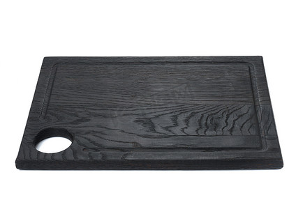白色孤立背景上带孔的矩形黑色木切厨房板
