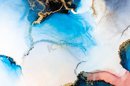 蓝色水墨摄影照片_大理石液体水墨艺术画在纸上的豪华蓝色抽象背景。