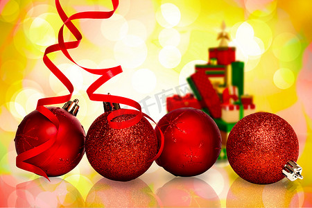 四个红色圣诞球装饰的合成图像