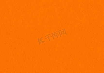 光滑的纸张摄影照片_高分辨率特写纸张纹理背景明亮，霓虹橙色，具有精细、光滑的无涂层纤维颗粒，具有小灰尘颗粒，用于壁纸、材料模型和设计