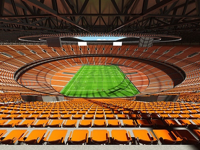 大型美丽的现代橄榄球体育场，配有橙色座椅和 VIP 包厢