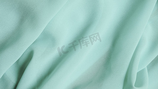 绿色窗帘摄影照片_绿色薄荷雪纺面料纹理背景