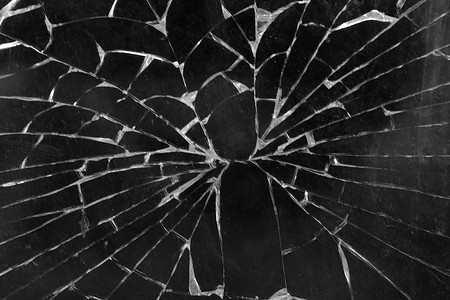 破碎的玻璃摄影照片_破碎的玻璃、手机或平板电脑屏幕的视图。