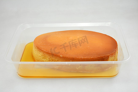 扁平美食摄影照片_放在扁平浴缸中的 Leche flan 菲律宾美食