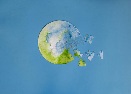 蓝色地球图案摄影照片_地球形状的拼图游戏