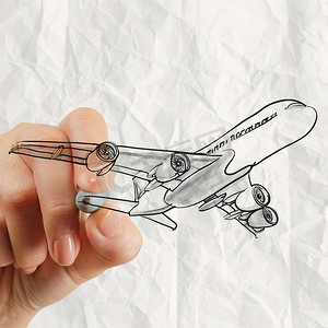 钢笔手绘摄影照片_手绘飞机与弄皱的纸背景