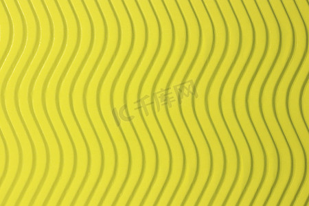 波浪线条纹理摄影照片_黄纸垂直波浪纹理。