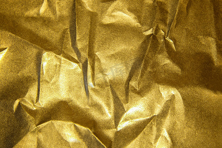 金色闪亮抽象金属皱纸背景