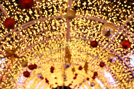 拱形散景金黄色五颜六色的圣诞快乐，新年快乐散景灯光闪耀在夜间背景，散景闪光灯，金色豪华背景纹理，闪闪发光的壁纸