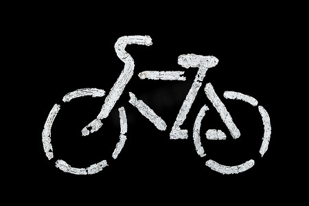 中模版摄影照片_用旧白漆在沥青上做自行车标志 — 黑色背景中突显