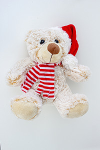 戴着圣诞帽的浅棕色泰迪熊的垂直视图