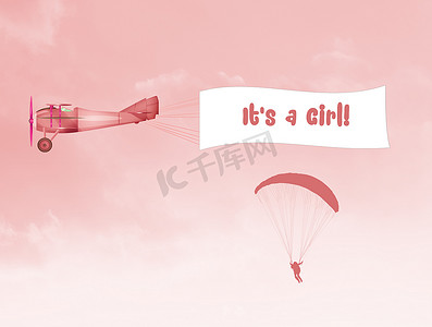 粉色降落伞摄影照片_有女婴横幅的飞机
