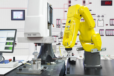 智能数控摄影照片_智能工厂、Indu 中的自动化机器人拾取汽车零件