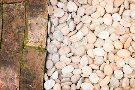 椭圆形不规则图形摄影照片_卵石石头和砖块抽象背景