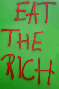 凸rich摄影照片_Eat The Rich 墙上的涂鸦