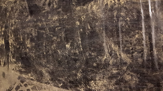 尘土免抠图摄影照片_尘土中肮脏的黑色聚乙烯的抽象背景。