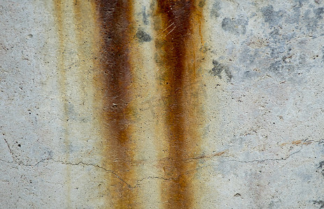 混凝土纹理背景上的铁锈。