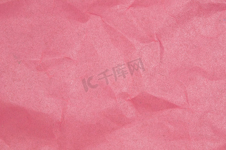 纸张褶皱纹理摄影照片_弄皱的纸张纹理-粉红色的纸页。