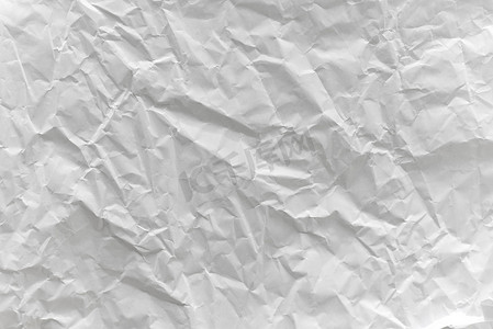 白色纸摄影照片_白纸或白皱纸纹理上的皱纹折痕