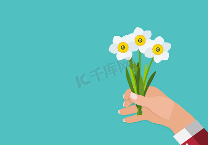 鲜花花束矢量摄影照片_一个男人的手握着春天水仙花背景矢量图