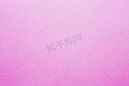 米色纸纹摄影照片_粉红色的纸纹理背景
