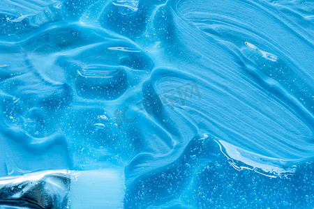 刷子和血清质地，蓝色背景上的透明凝胶气泡。