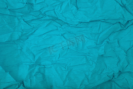 水模板摄影照片_水蓝色皱巴巴的瓦楞纸包装纸背景，带有文本空间