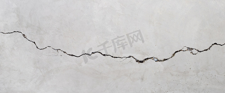 破裂的水泥墙壁纹理背景。