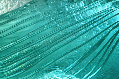 深海凤尾鱼摄影照片_深海蓝色玻璃纹理背景。