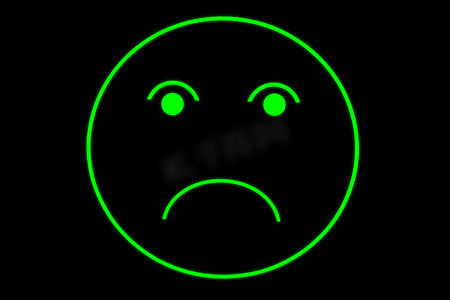 霓虹灯轮廓中悲伤的笑脸或面孔，黑色背景上发出绿色光芒，显示出负面情绪