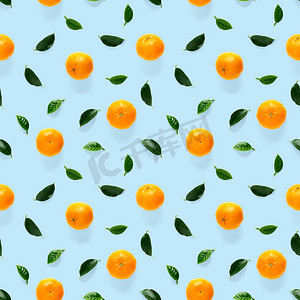 普通话无缝图案，橘子，克莱门汀隔离在蓝色背景与绿叶。