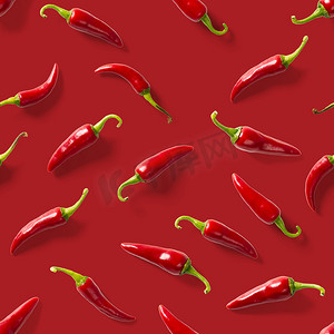 无缝图案由红辣椒或红色背景上的辣椒制成。