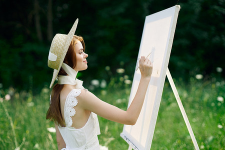 风景图画摄影照片_大自然中穿白裙的女人描绘了一幅风景爱好的图画