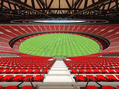 美丽的现代圆形澳大利亚规则足球场，配有红色座椅和 VIP 包厢